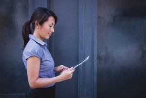 a woman watching a movie online